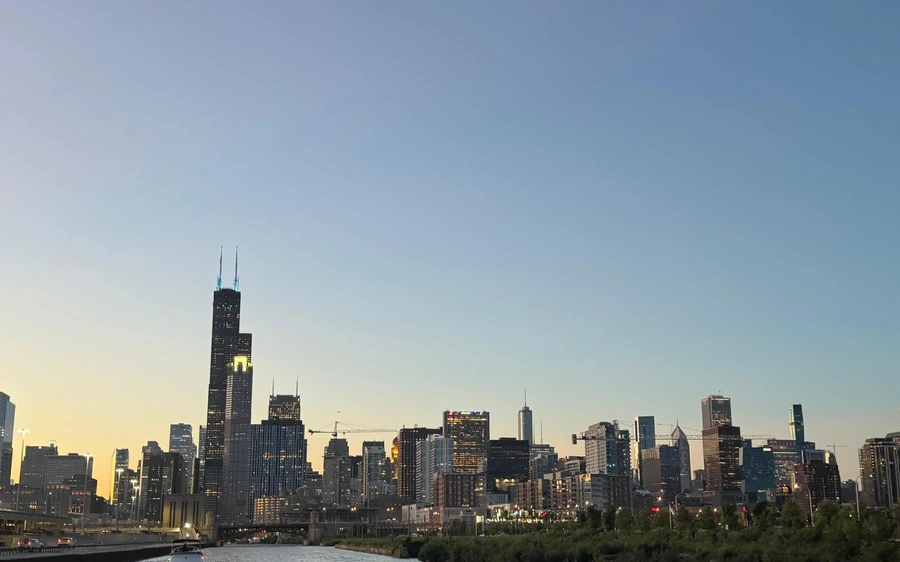 The Chicago skyline and Willis Tower against an evening sky