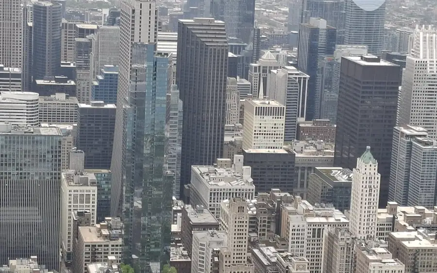 Downtown Chicago towers packed below, seen from high above the city