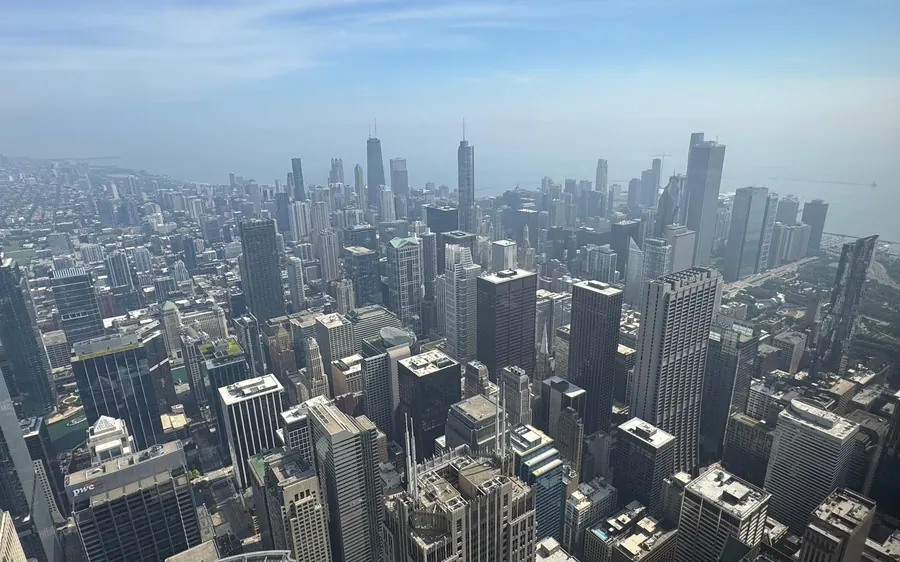 The grid of Chicago towers running to a hazy horizon from far above